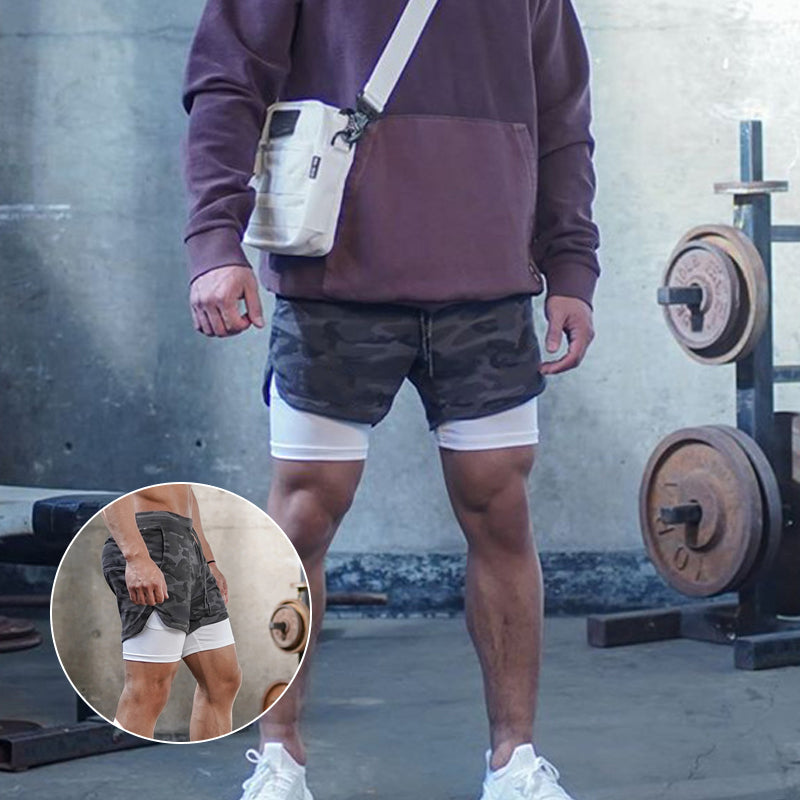 "Sportiga herrshorts 2-i-1 i kamouflage med fickor, polyester-bomullstyg, gröna nyanser, perfekt för träning och fritid."