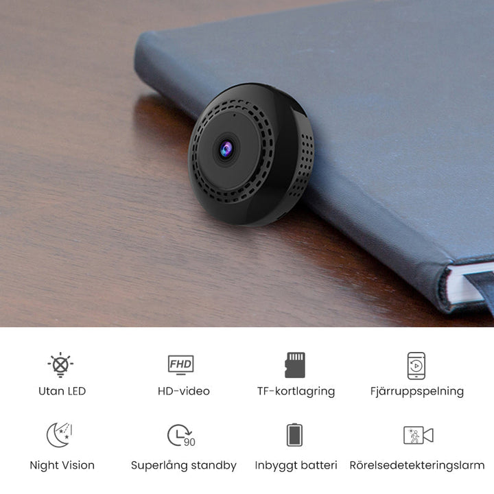 Svart mini WiFi-kamera för hem och bil, kompakt design, högupplöst video, night vision, magnetisk bas för enkel placering.