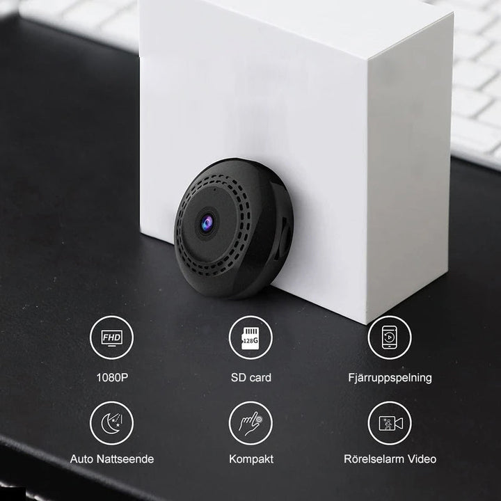 Svart mini WiFi-kamera för hem och bil, kompakt design, högupplöst video, night vision, magnetisk bas för enkel placering.