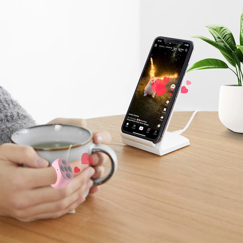 "Trådlös Bluetooth-ringfjärrkontroll för mobil, ergonomisk design, kompakt storlek, finns i svart, rosa, vit."