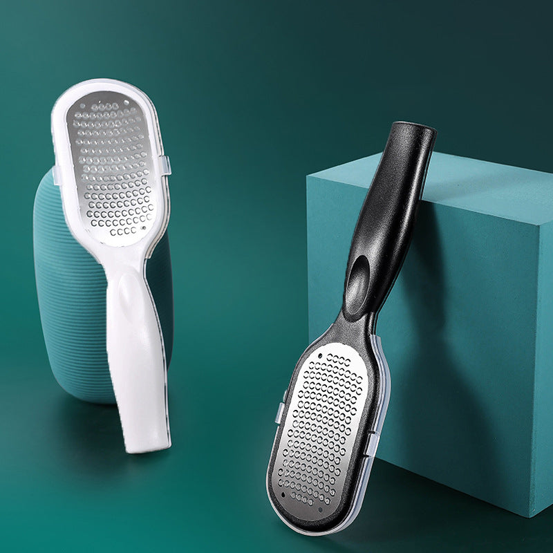 "Unisex exfolierande fotverktyg med ergonomiskt handtag och dubbelsidig användning för säker borttagning av död hud."