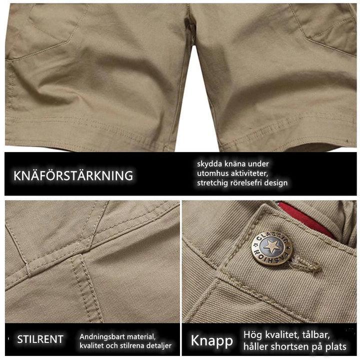 "Vattentåliga herrvandrarshorts med flera fickor, elastiskt midjeband och förstärkt tyg i grön färg, främre vy."