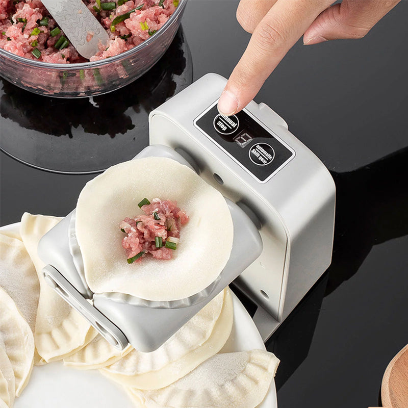 "Vit elektrisk dumplingsmaskin i modern design, USB-uppladdningsbar, köksprodukt för snabb och enkel dumplingstillverkning."