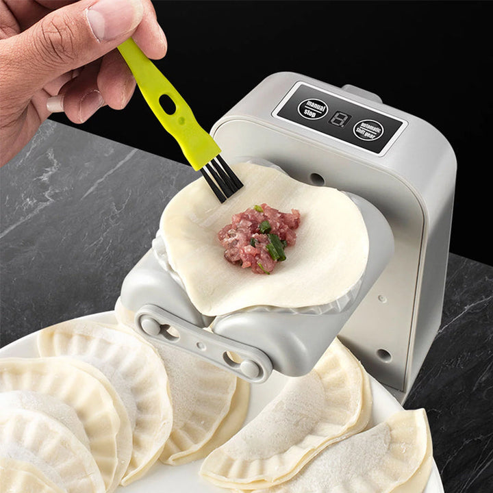 "Vit elektrisk dumplingsmaskin i modern design, USB-uppladdningsbar, köksprodukt för snabb och enkel dumplingstillverkning."